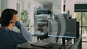 Software developer programming source code algorithm on computer