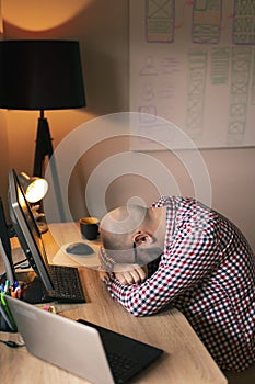 Software developer tired while working overtime