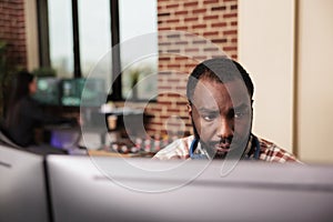 Software developer typing javascript code on computer