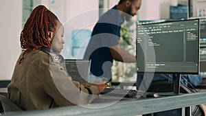 Software developer typing programming code on computer