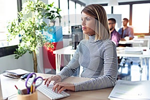 Software developer working with computer in the modern startup office