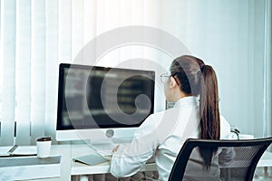 Software developers are analyzing about the code written into the program on the computer in office room