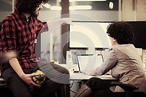 Software developers couple writing programming code