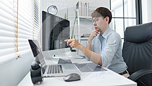 Software development concept, Male programmer pointing on laptop screen to checking data codes