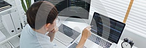 Software development concept, Male programmer pointing on laptop screen to checking data codes