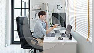 Software development concept, Male programmer pointing on laptop screen to checking data codes