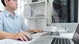 Software development concept, Male programmer typing data code on laptop to develop app and website