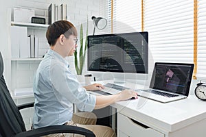 Software development concept, Male programmer typing data code on laptop to develop app and website