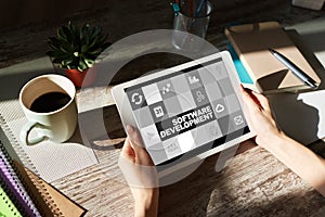 Software development and process automation concept on tablet computer screen.