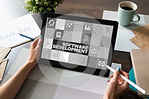 Software development and process automation concept on tablet computer screen.