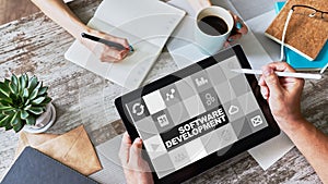 Software development and process automation concept on tablet computer screen.