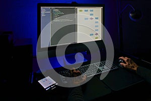 Software Development Process with Code and Flowchart on Screen