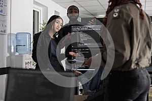 Software engineers collaborating on coding project talking about programming algorithm