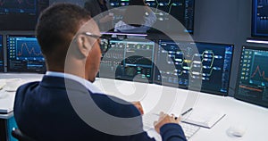 Team of IT technical specialists work in monitoring office
