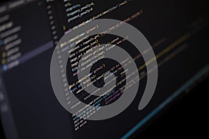Software source code. Program code. Code on a computer screen. The developer is working on program codes in the office.