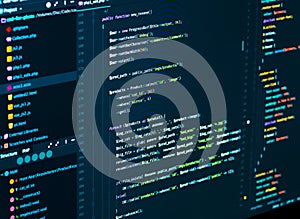 Software source code. Programming code. Splitting of css and php code on computer screen, closeup