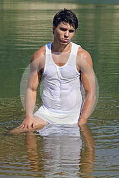 soggy muscle man standing in water