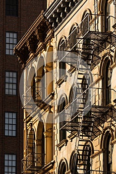 Soho building facades and fire escapes, New York City photo