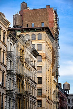 Soho loft buildings with fire escape and water towers, Manhattan
