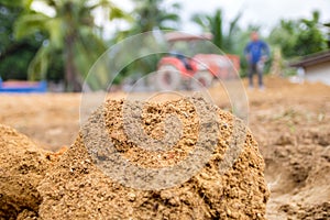 Soil with blurred of a tractor driver for plow the soil