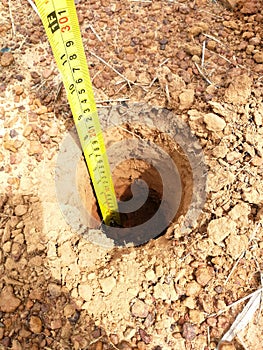 Soil depth measurement by soil auger and meter