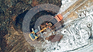 Soil is getting scooped by the excavating machine