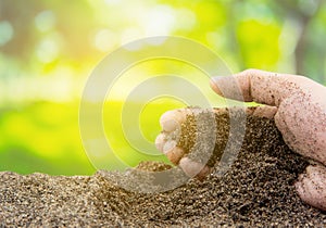 Soil in hand with organic garden - agriculture.