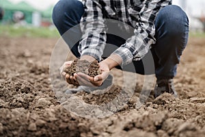 Soil in the hands of farmers. Concept of agriculture