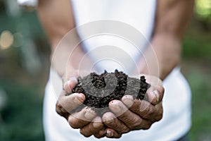 Soil in the hands of farmers. Concept of agriculture