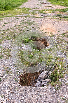 Soil hole on road