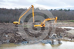 Soil pollution restoration with excavating and earthmoving work.