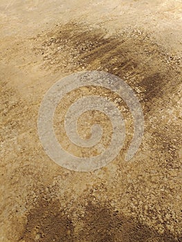 Soil texture, dirt road or dry mud, of different shades of brown. Dry cracked sand abstract background, Rough brown red earth