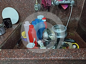 soiled utensils in a sink for cleaning