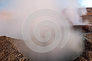 The Sol de la Manana, Rising Sun steaming geyser field high up in a massive crater in Bolivian Altiplano, Bolivia photo