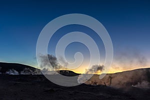 The Sol de la Manana, Rising Sun steaming geyser field high up in a massive crater in Bolivian Altiplano, Bolivia photo
