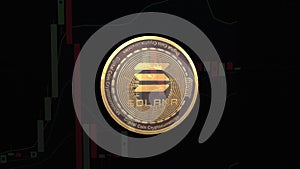 Solana crypto token in the form of a gold coin close-up on a black background