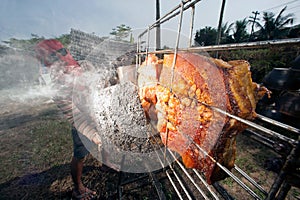 Solar-Barbecued pork from a glass.