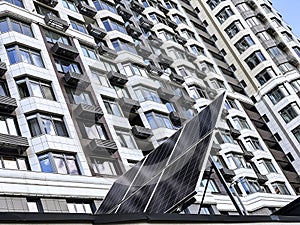 The solar battery panel mounted near modern apartment building in Kyiv, Ukraine