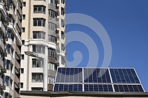 The solar battery panel mounted near modern apartment building in Kyiv, Ukraine