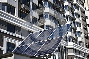 The solar battery panel mounted near modern apartment building in Kyiv, Ukraine