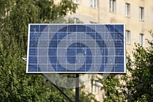 The solar battery panels mounted on the balcony of an apartment building