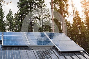 Solar cell panel on roof house with sunlight shining in the forest