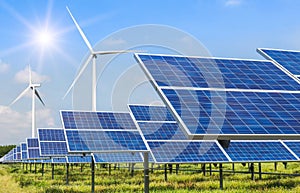 Solar cells and wind turbines generating electricity in power station alternative renewable energy