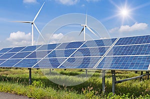 Solar cells and wind turbines generating electricity in power station alternative renewable energy