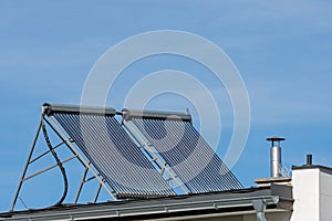 Solar collectors on the roof of a family house
