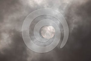 Solar eclipse on a cloudy day.