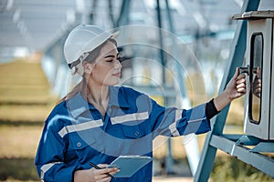Solar electric installer and practitioner inspect electrical systems for appropriate wiring, polarity, grounding, and termination
