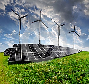 Solar energy panels with wind turbines