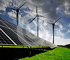 Solar energy panels with wind turbines