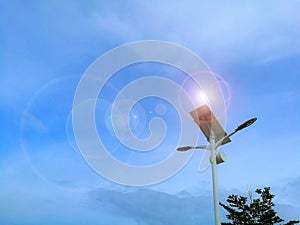 Solar energy and streetlight on blue sky. Green energy concept